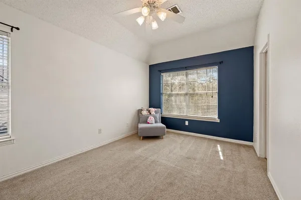 a view of a swimming pool with a yard