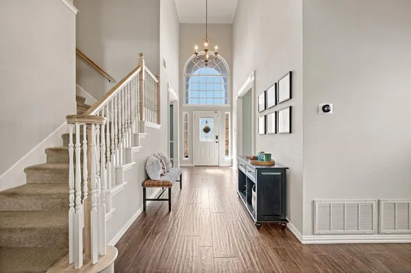 a view of a livingroom with furniture and a window