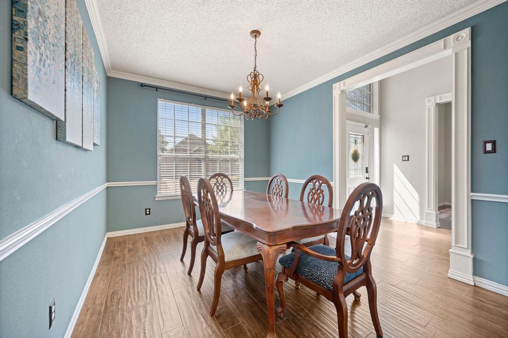 417 Shade Tree Circle Hurst, TX 76054 - Photo 6 of 39 a view of a dining room with furniture window and wooden floor