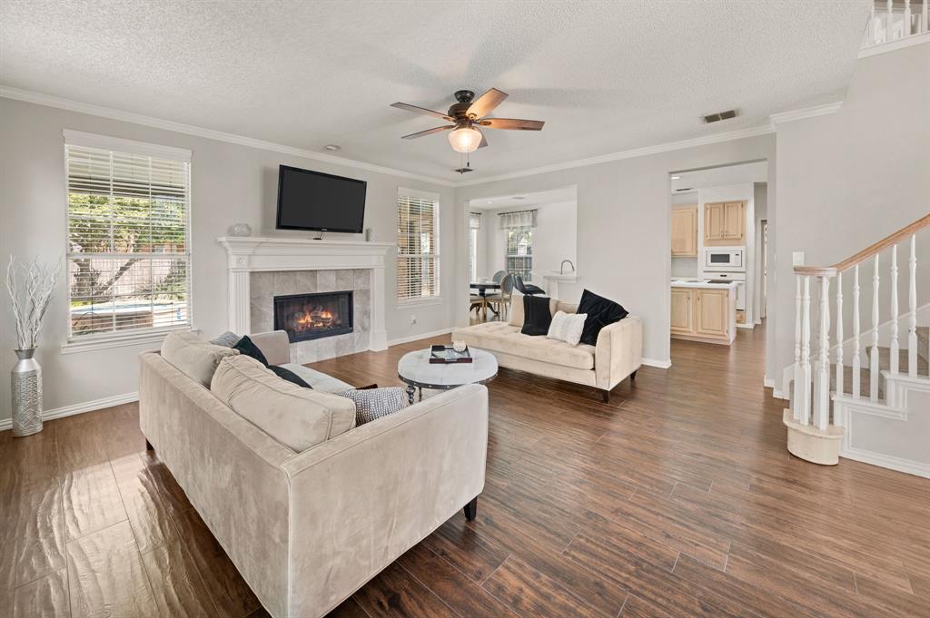 417 Shade Tree Circle Hurst, TX 76054 - Photo 8 of 39 a living room with furniture and a fireplace
