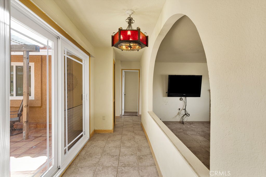 9072 Green Road Pinon Hills, CA 92372 - Photo 30 of 70 hallway that opens on to central courtyard