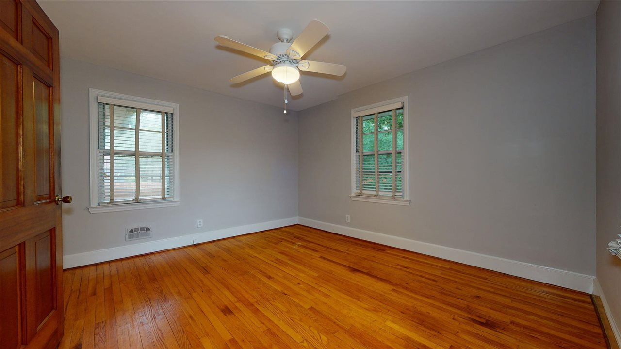 2516 North Roxboro Street Durham, NC 27704 - Photo 16 of 24 The back bedroom has good natural light and beautiful hardwood floors. Bedroom