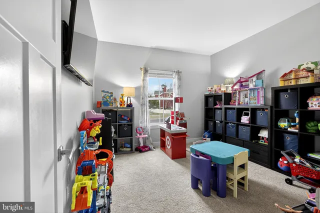 a kitchen with stainless steel appliances granite countertop a kitchen island hardwood floor sink stove and cabinets