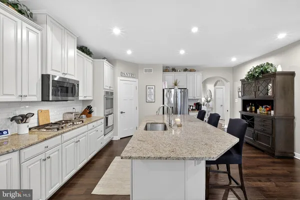 a living room with fireplace furniture and a flat screen tv