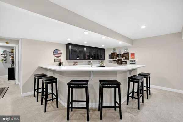 a view of a livingroom with kitchen view