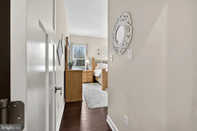 a bedroom with a large bed and a dresser