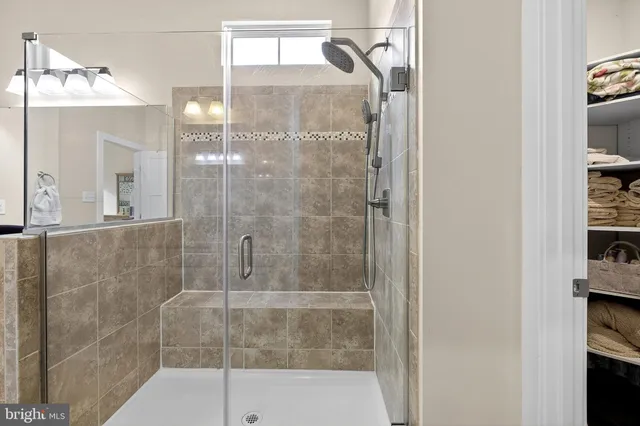 a bedroom with a bed and a desk