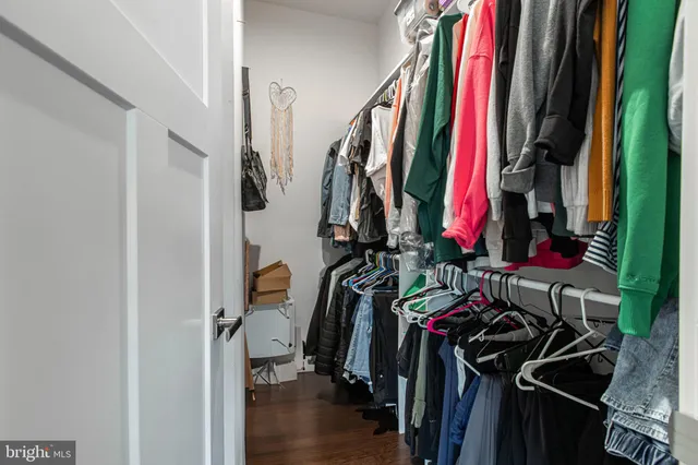 a roof deck with table and chairs and wooden floor