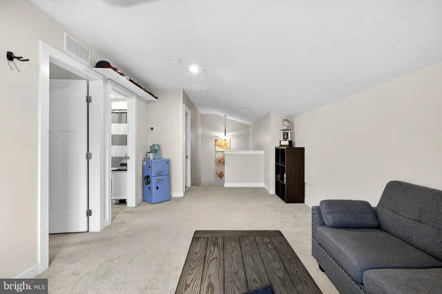 a view of a chairs and tables in the balcony