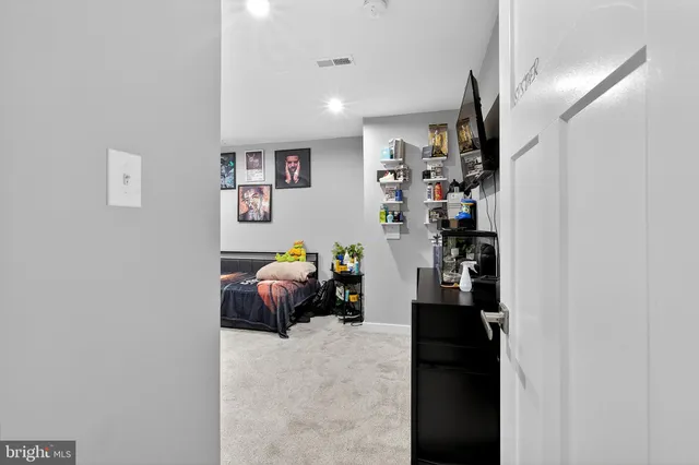 an aerial view of a house with garden space and street view