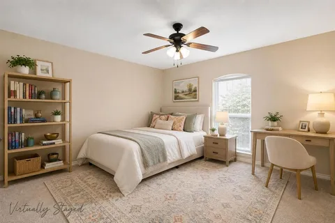 a bed room with a bed and a table in it