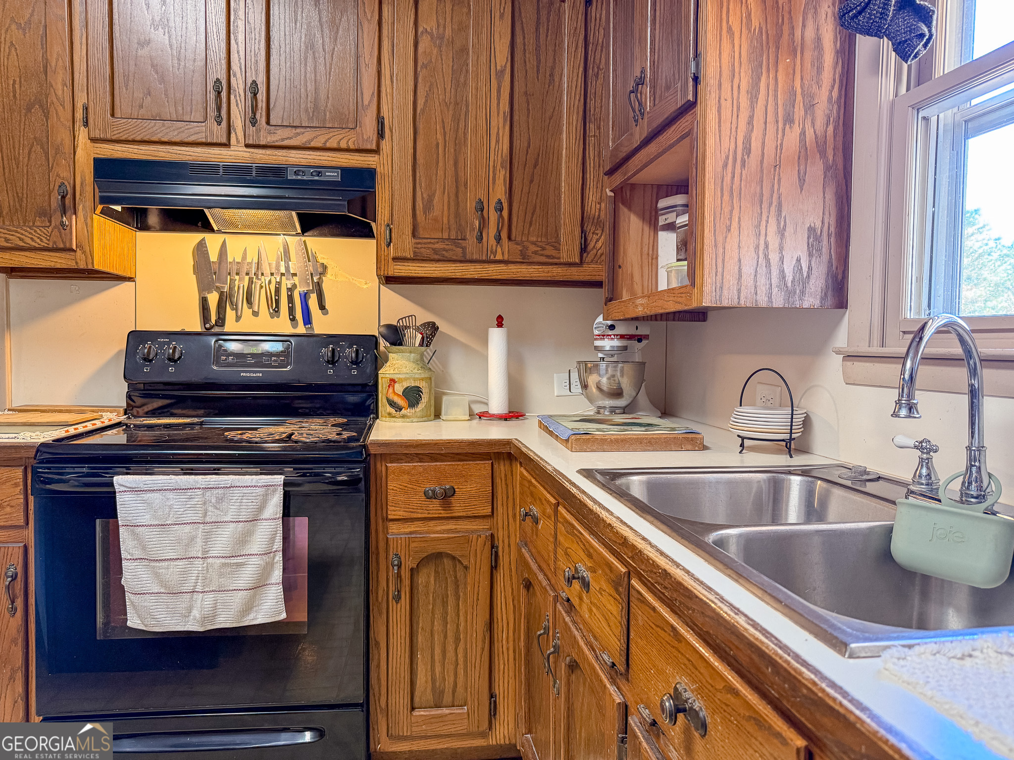162 College Street Parrott, GA 39877 - Photo 11 of 30 a kitchen with stainless steel appliances granite countertop a sink stove and cabinets