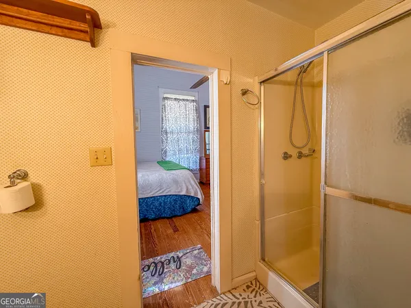 a bed room with a bed and a window