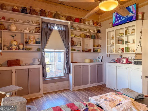 a bedroom with a bed and a fireplace