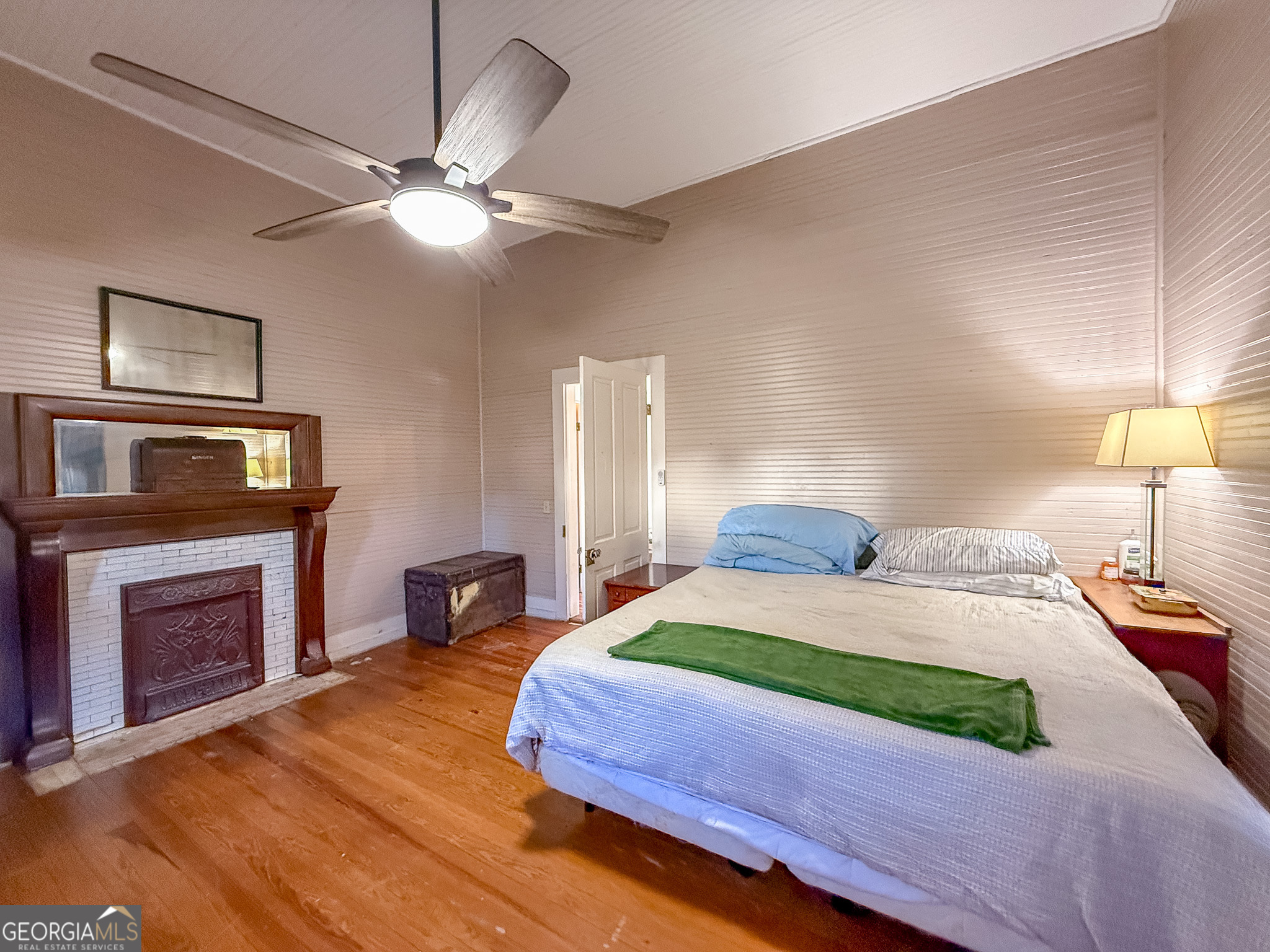 162 College Street Parrott, GA 39877 - Photo 17 of 30 a bedroom with a bed and a fireplace