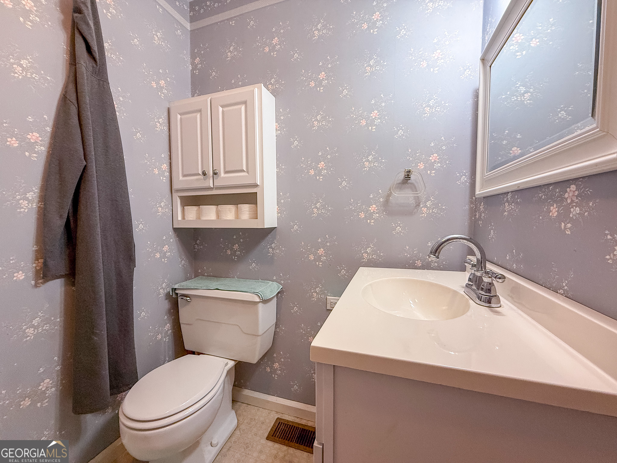 162 College Street Parrott, GA 39877 - Photo 19 of 30 a bathroom with a toilet sink and mirror