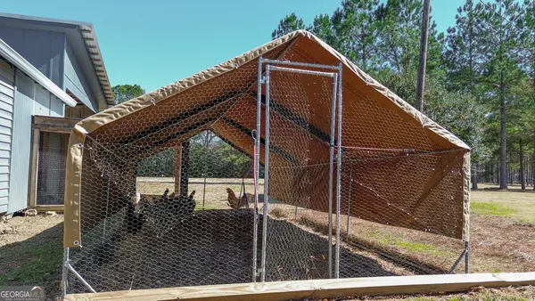 a front view of a house with wooden fence