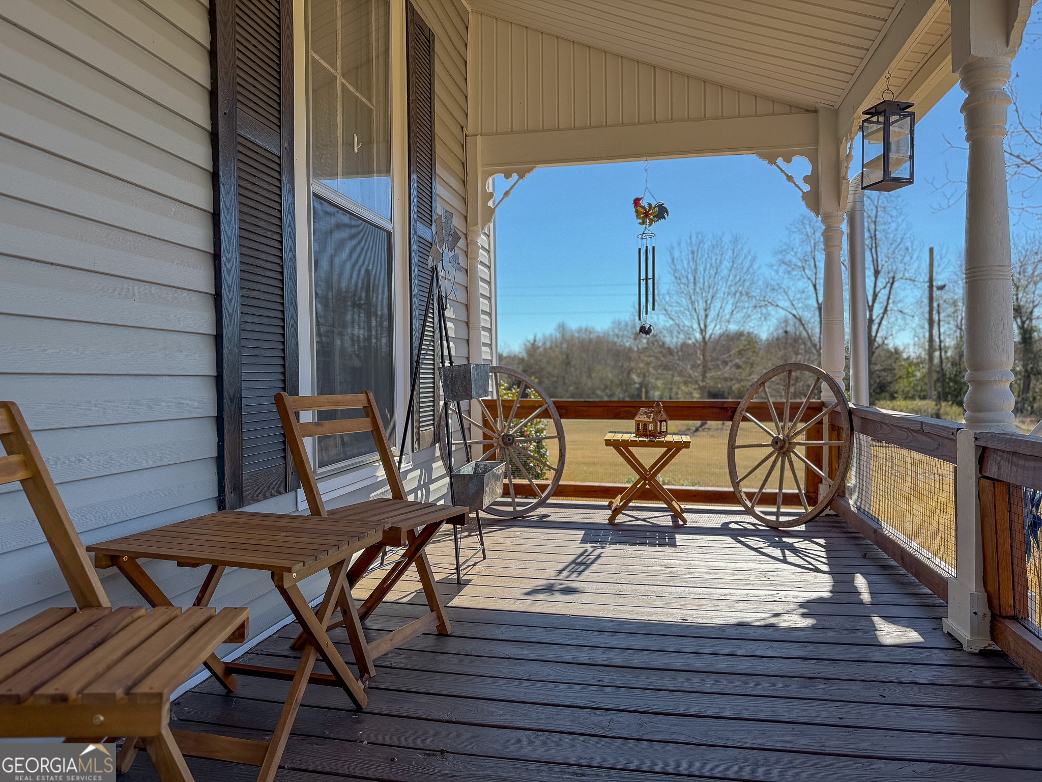 162 College Street Parrott, GA 39877 - Photo 5 of 30 a view of a balcony with chairs and wooden floor