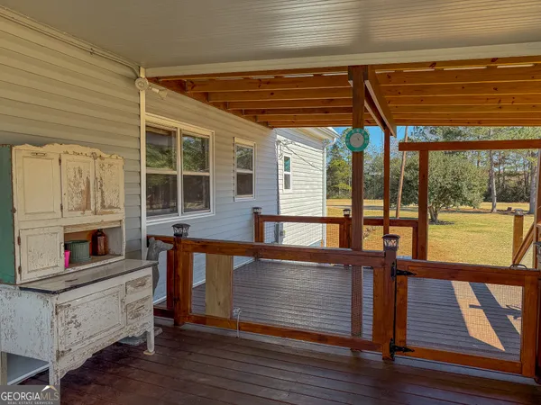 a view of an entryway with wooden floor