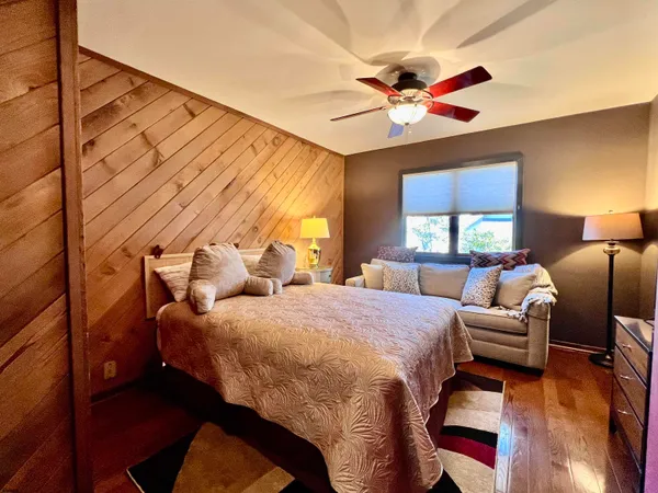 a view of backyard with barbeque grill and outdoor seating