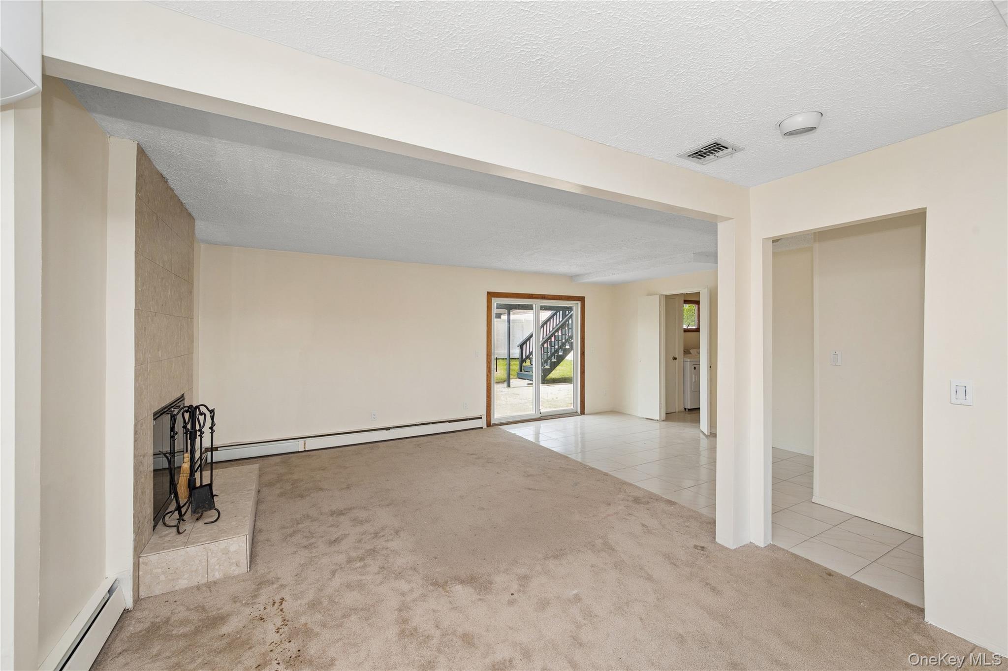 2625 Riverside Drive Wantagh, NY 11793 - Photo 5 of 20 an empty room with windows