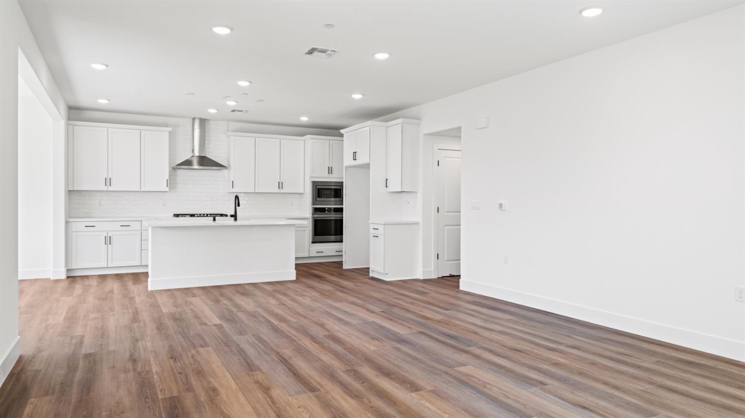 770 Lorca Street Mountain House, CA 95391 - Photo 13 of 38 a view of kitchen with wooden floor
