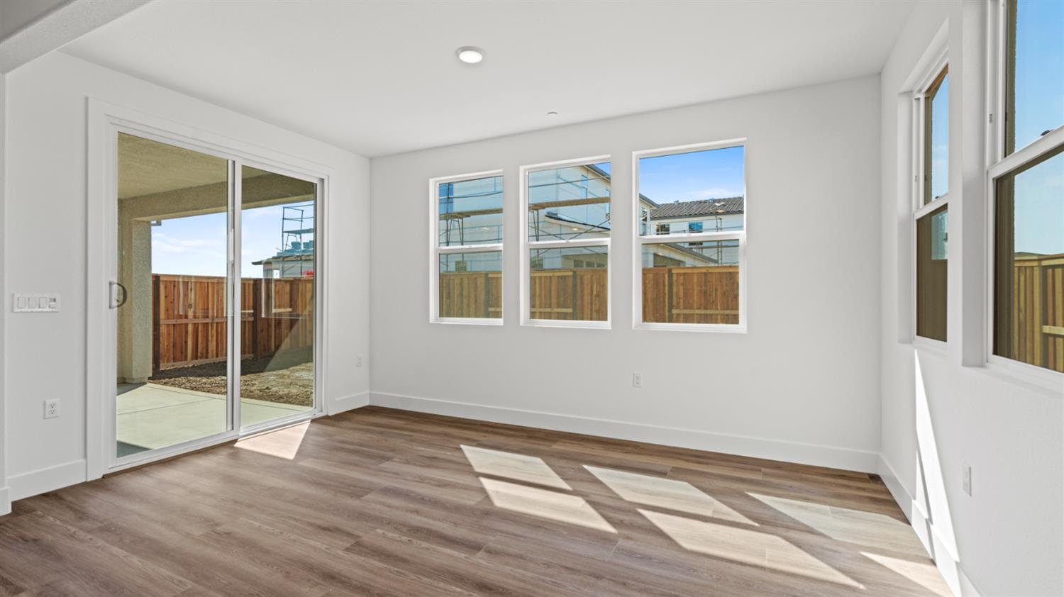 770 Lorca Street Mountain House, CA 95391 - Photo 19 of 38 a view of an empty room with wooden floor and a window