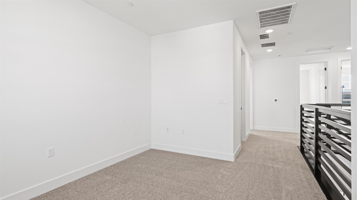 770 Lorca Street Mountain House, CA 95391 - Photo 22 of 38 an empty room with wooden floor and entryway