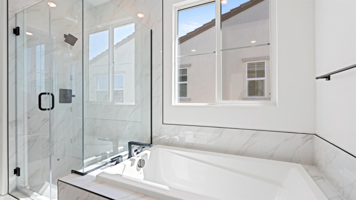 770 Lorca Street Mountain House, CA 95391 - Photo 28 of 38 a bathroom with a bathtub and a shower