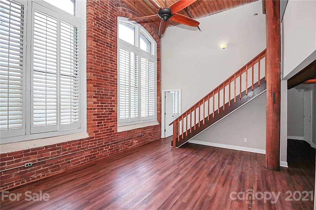 201 South Hoskins Road, Unit 237 Charlotte, NC 28208 - Photo 17 of 46 a view of an entryway with wooden floor and stairs