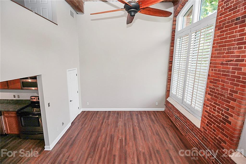 201 South Hoskins Road, Unit 237 Charlotte, NC 28208 - Photo 22 of 46 a view of a room with wooden floor and a window