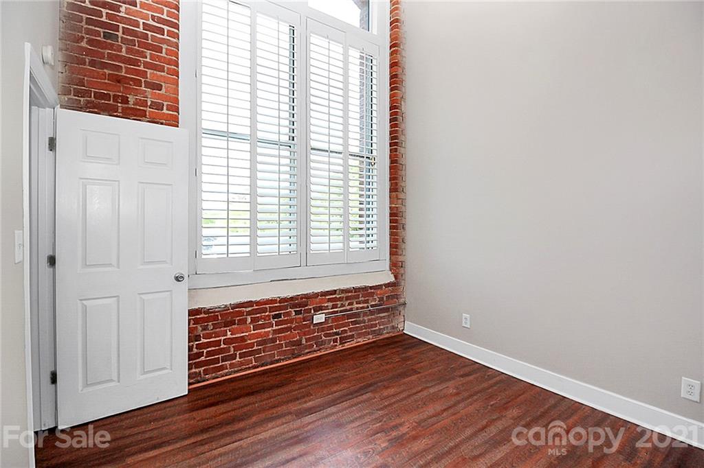 201 South Hoskins Road, Unit 237 Charlotte, NC 28208 - Photo 24 of 46 a view of a room with wooden floor and window