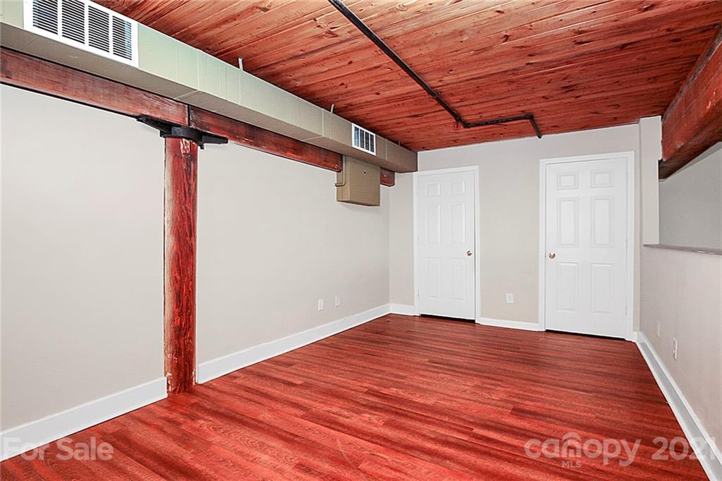 201 South Hoskins Road, Unit 237 Charlotte, NC 28208 - Photo 30 of 46 a view of empty room with wooden floor
