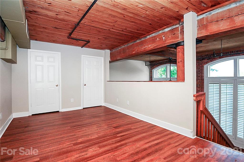 201 South Hoskins Road, Unit 237 Charlotte, NC 28208 - Photo 31 of 46 a view of empty room with wooden floor