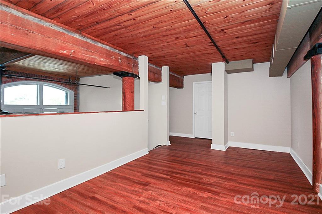 201 South Hoskins Road, Unit 237 Charlotte, NC 28208 - Photo 32 of 46 a view of a room with wooden floor