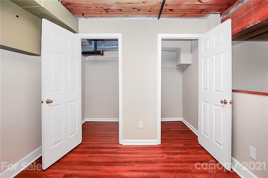 201 South Hoskins Road, Unit 237 Charlotte, NC 28208 - Photo 34 of 46 a view of a hallway with wooden floor and closet