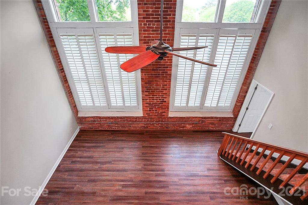 201 South Hoskins Road, Unit 237 Charlotte, NC 28208 - Photo 35 of 46 a view of front door with wooden floor