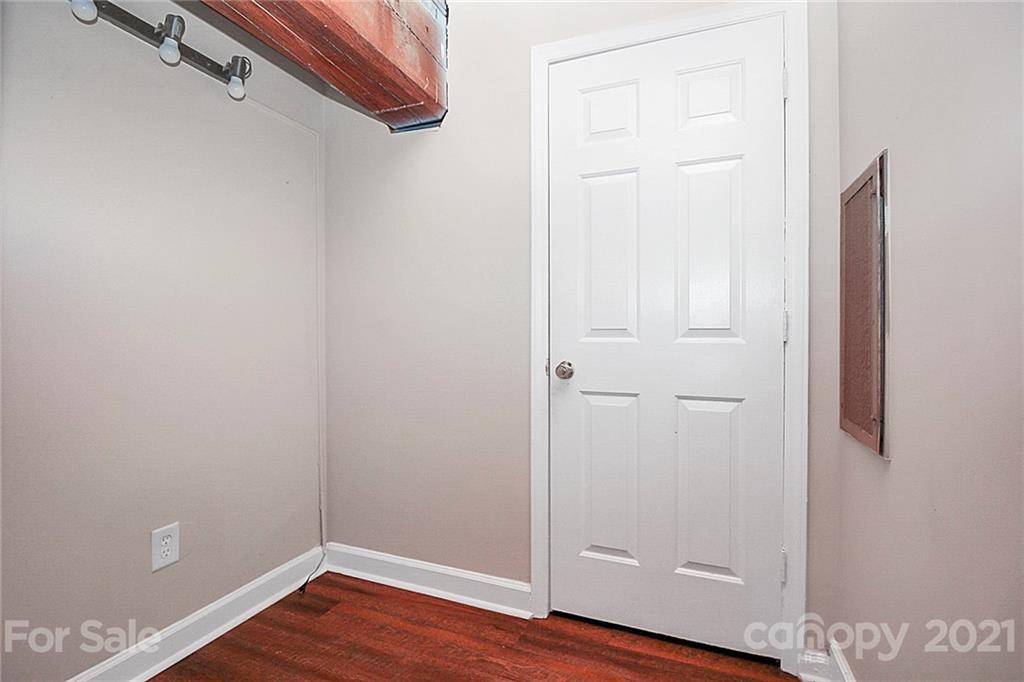 201 South Hoskins Road, Unit 237 Charlotte, NC 28208 - Photo 36 of 46 a view of a room with wooden floor