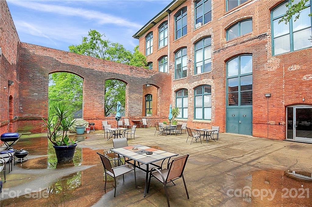 201 South Hoskins Road, Unit 237 Charlotte, NC 28208 - Photo 41 of 46 a view of a building with sitting area