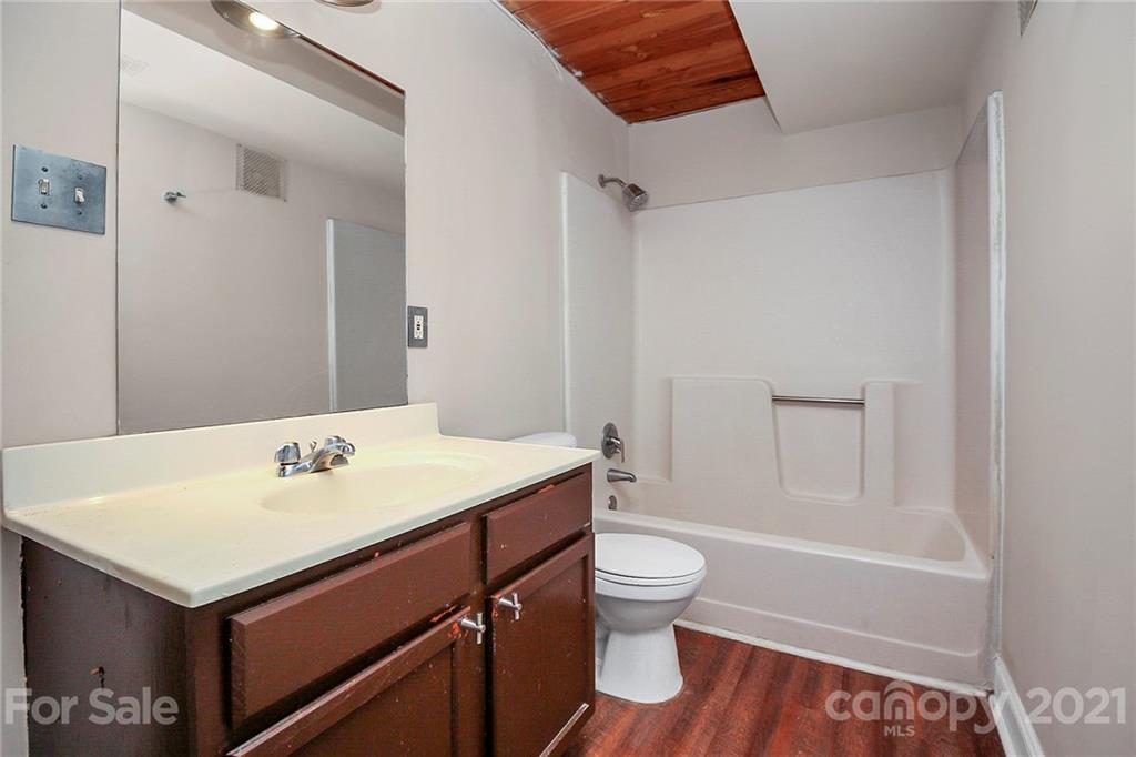 201 South Hoskins Road, Unit 237 Charlotte, NC 28208 - Photo 8 of 46 a bathroom with a sink toilet and shower