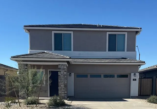 a kitchen with granite countertop stainless steel appliances a sink stove top oven and cabinets