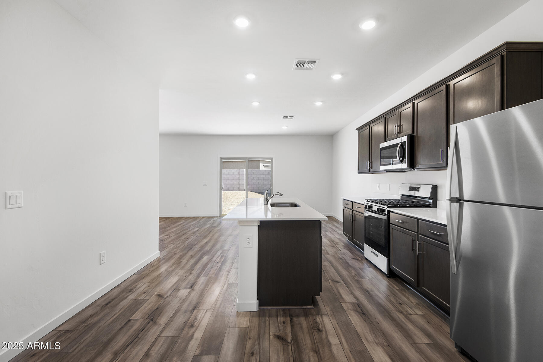 708 Maricopa Road Florence, AZ 85132 - Photo 3 of 5 a kitchen with a refrigerator and a sink