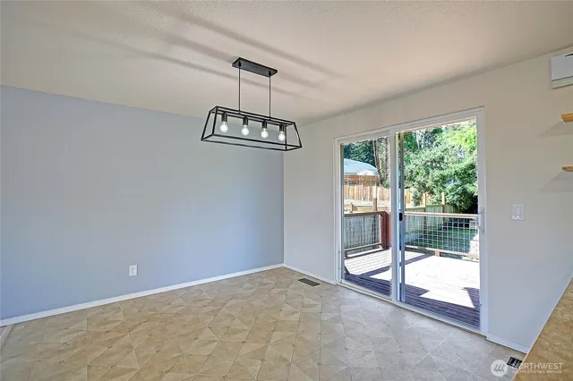 a view of balcony with wooden floor and fence