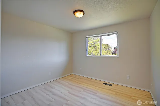 a aerial view of a house with yard and green space
