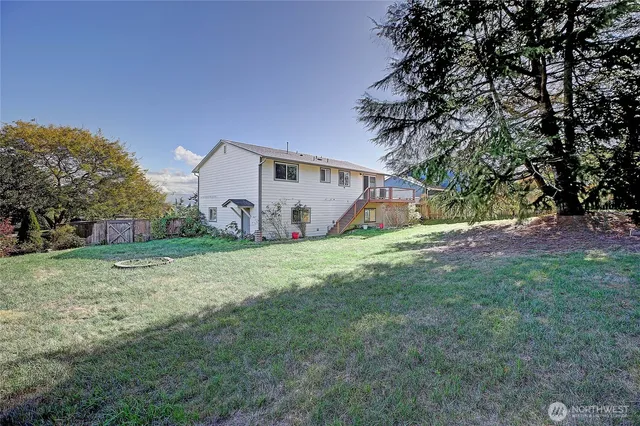 a view of a livingroom with furniture and a window