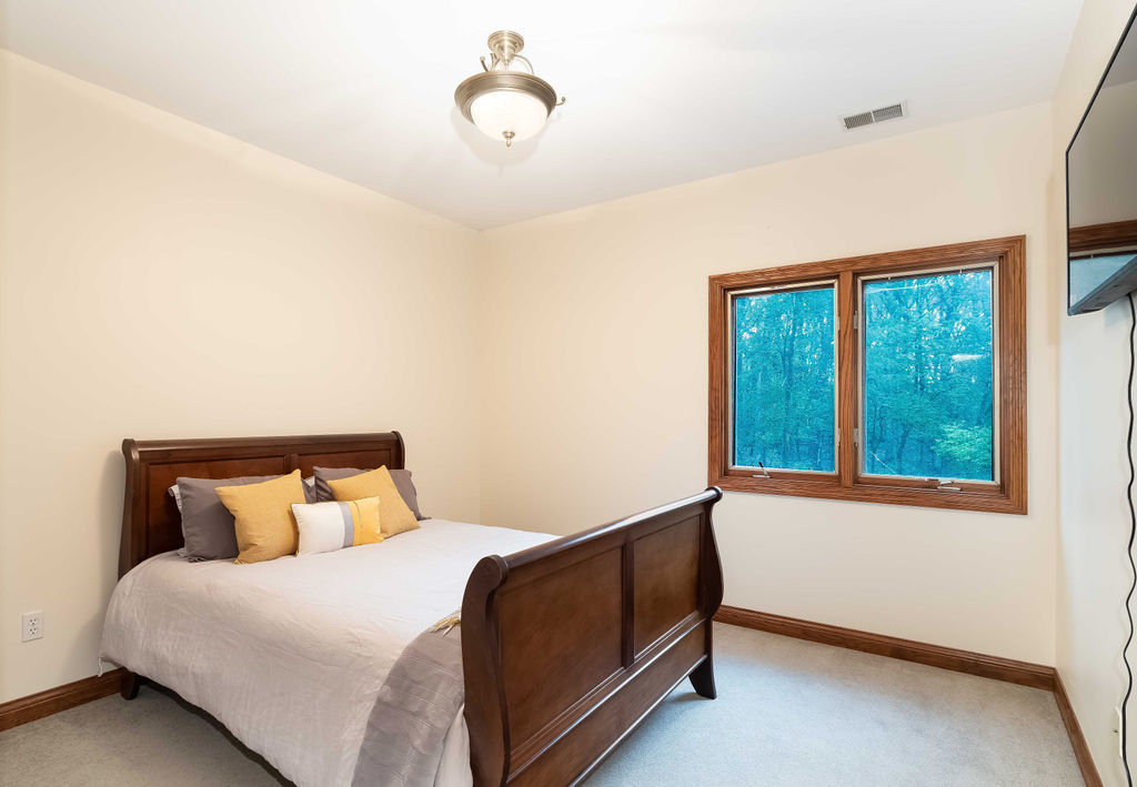 3208 Buried Oak Drive Crete, IL 60417 - Photo 19 of 26 a bedroom with a bed and a window