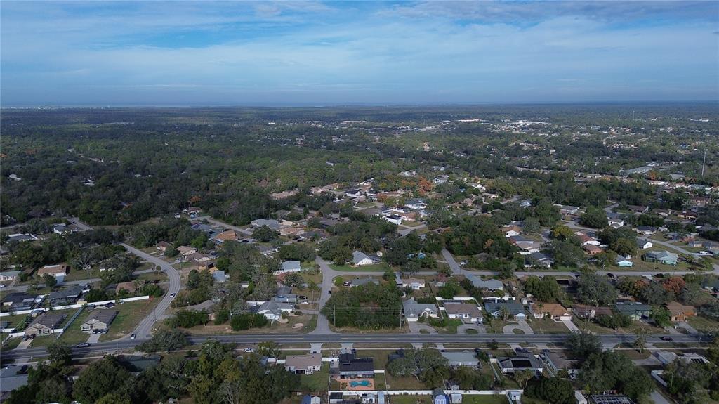 3263 Deltona Boulevard Spring Hill, FL 34606 - Photo 13 of 18 an aerial view of multiple house