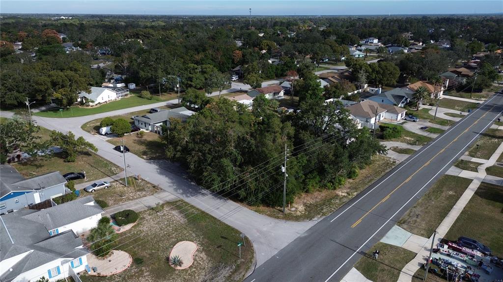3263 Deltona Boulevard Spring Hill, FL 34606 - Photo 15 of 18 an aerial view of residential houses with outdoor space