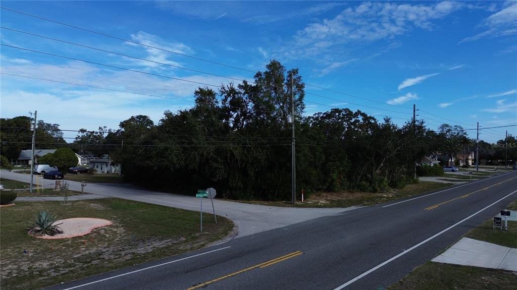 3263 Deltona Boulevard Spring Hill, FL 34606 - Photo 16 of 18 a view of a swimming pool with a yard