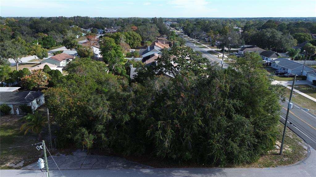 3263 Deltona Boulevard Spring Hill, FL 34606 - Photo 2 of 18 an aerial view of residential house with green space